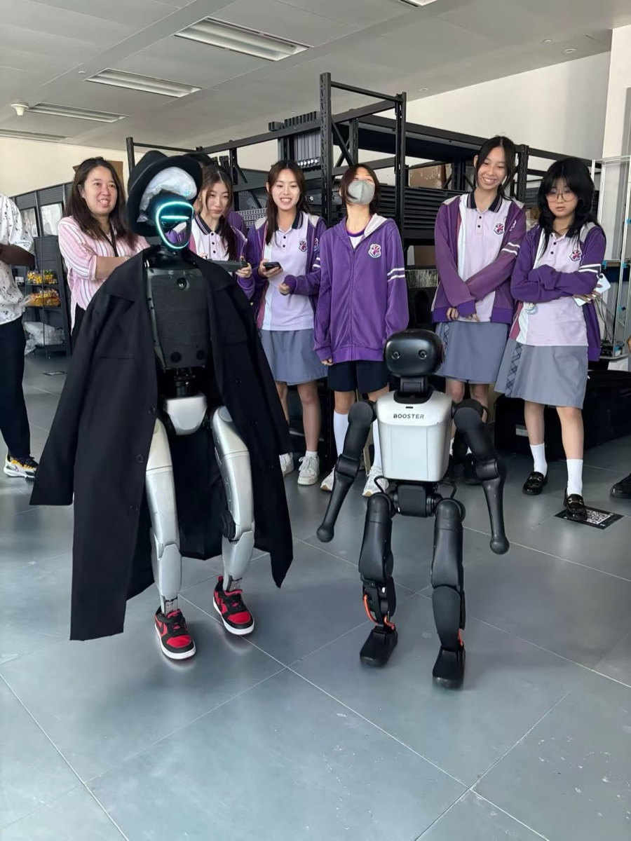 Bluebell College students with humanoid and quadruped robots at a Hong Kong school event